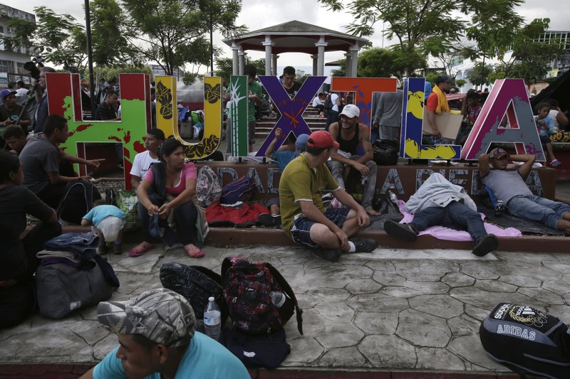 Central American migrants making their way to the US rest in a park after arriving to Huixtla, Mexico, on Monday, Oct. 22, 2018. Photo: AP