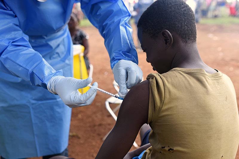 FILE PHOTO: A Congolese health worker administers Ebola vaccine to a boy who had contact with an Ebola sufferer in the village of Mangina in North Kivu province of the Democratic Republic of Congo, August 18, 2018. Photo: Reuters