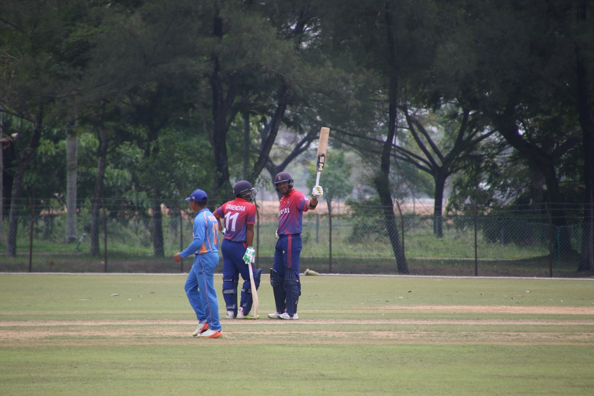 Nepal skipper Paras Khadka (right) celebrates his half century against Malaysia during their ICC World T20 Asia Region Qualifier B match in Kuala Lumpur on Saturday, October 6, 2018. Photo: THT
