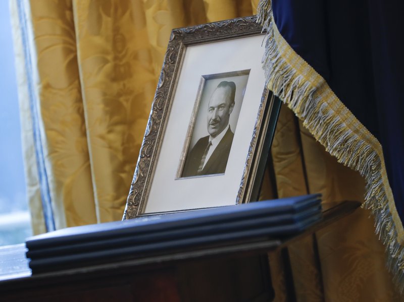 FILE - In this photo, a portrait of President Donald Trumpu2019s father Fred Trump, and three un-signed Executive orders are seen in the Oval Office of the White House in Washington on Feb. 9, 2017. Photo: AP
