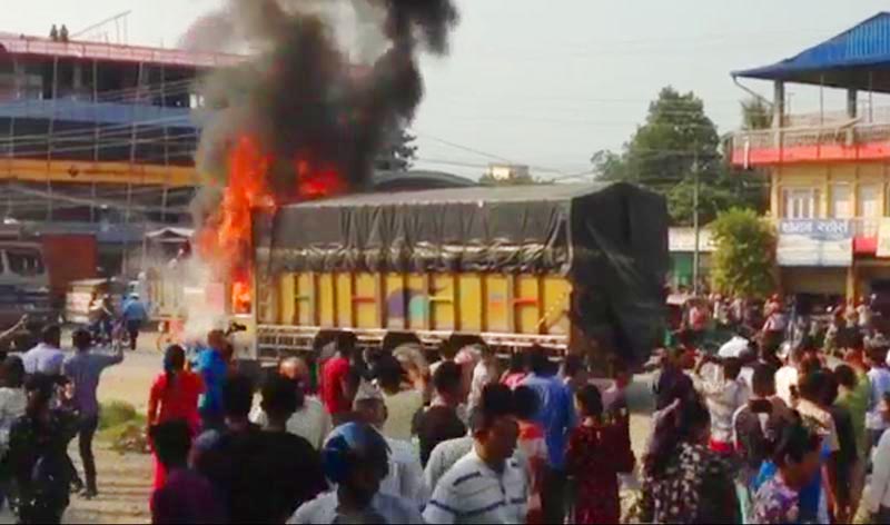 A truck that locals set on fire after it hit a motorcycle rider, who died on the spot, along the East-West Highway in Khairahani Municipality, Chitwan, on Thursday, October 4, 2018. Photo: THT