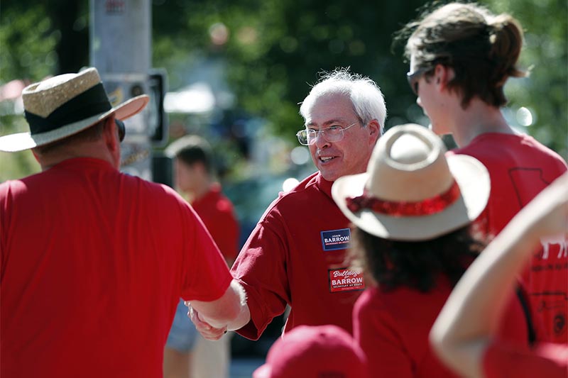Democratic candidate for Georgia Secretary of State John Barrow greets people outside Sanford Stadium on the University of Georgia campus before an NCAA college football game between Georgia and Middle Tennessee in Athens, Georgia, on September 15, 2018. Photo: AP
