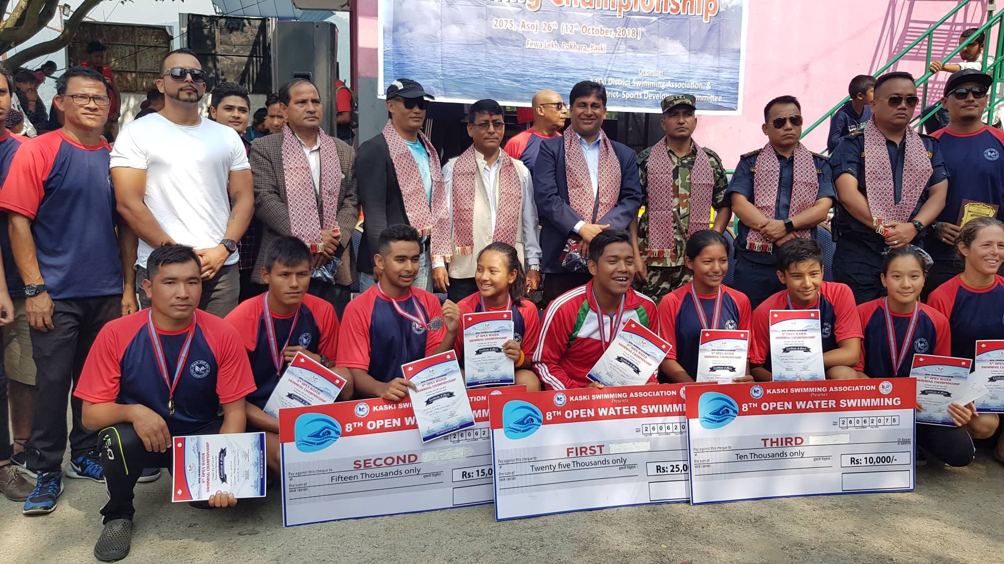Winners of the Open Water Swimming Tournament with officials in Pokhara on Friday, October 12, 2018. Photo: THT