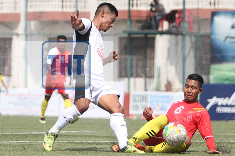 Karna Limbu (left) of Himalayan Sherpa Club vies for the ball against Aaditya Chaudhary of Nepal APF Club during their Martyrs Memorial u2018Au2019 Division League at ANFA Ground in Satdobato, Lalitpur on Friday, October 12, 2018. Photo: Udipt Singh Chhetry/THT