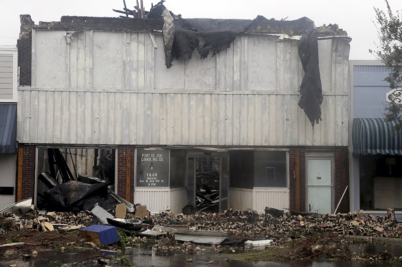 Port St Joe Lodge No 111 lay in ruins after Hurricane Michael made landfall in Port St Joe, Florida, on Wednesday, October 10, 2018. Supercharged by abnormally warm waters in the Gulf of Mexico, Hurricane Michael slammed into the Florida Panhandle with terrifying winds of 155 mph Wednesday, splintering homes and submerging neighbourhoods. Photo: Douglas R. Clifford/Tampa Bay Times via AP