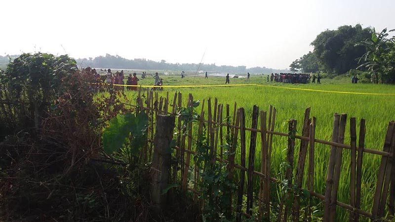 Locals, along with security personnel, gathering in a paddy field where the body of Imatiyaj Miya, 15, who had gone missing on Friday, was found in Itahari, Sunsari, on Tuesday, October 2, 2018. Photo: THT
