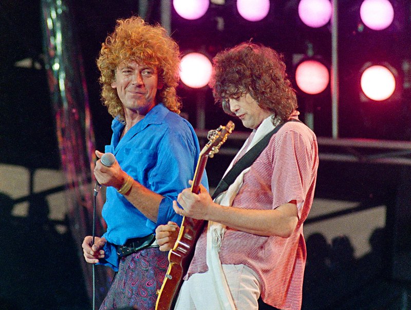 FILE - In this photo, Led Zeppelin bandmates, singer Robert Plant, left, and guitarist Jimmy Page, reunite to perform for the Live Aid famine relief concert at JFK Stadium in Philadelphia on July 13, 1985. 