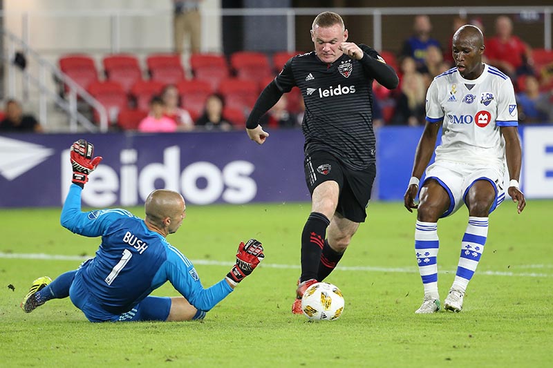 DC United forward Wayne Rooney (9) attempts to control the ball in front of Montreal Impact goalkeeper Evan Bush (1) and Montreal Impact defender Rod Fanni (15) in the first half at Audi Field, in Washington, DC, USA, on  September 29, 2018. Photo: Geoff Burke-USA TODAY Sports via Reuters