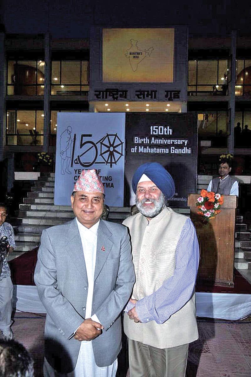 Acting Prime Minister Ishwor Pokharel and Indian Ambassador Manjeev Singh Puri posing for a picture during a programme held to mark the 150th birth anniversary of Mahatma Gandhi, in Kathmandu, on Tuesday, October 2, 2018. Photo: THT