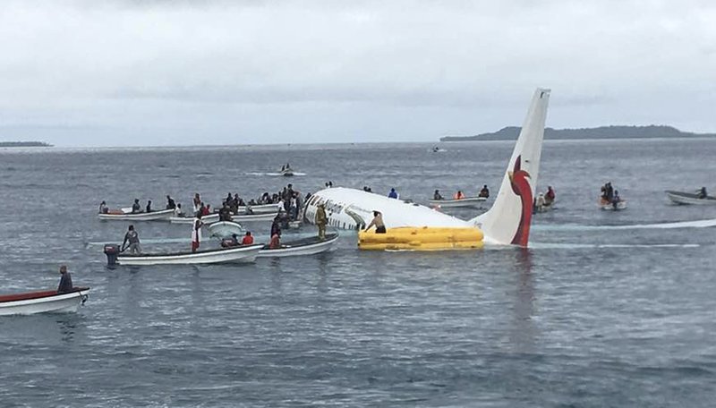 FILE - In this photo, local fishing boats move in to recover the passengers and crew of Air Niugini flight following the plane crashing into the sea on its approach to Chuuk International Airport in the Federated States of Micronesia on  Sept. 28, 2018. Photo: AP 