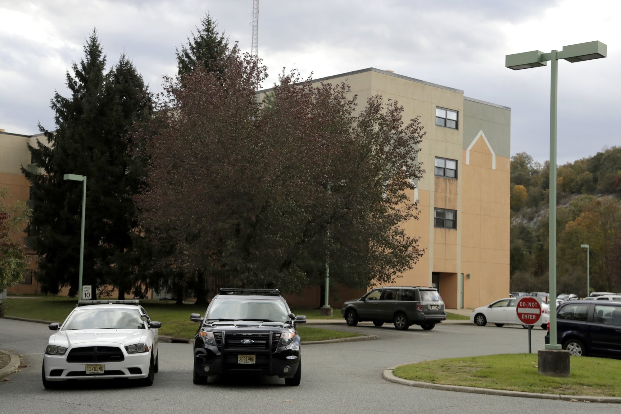 Police cruisers are seen parked near the entrance of the Wanaque Center For Nursing And Rehabilitation, where New Jersey state Health Department confirmed the 18 cases of adenovirus, on Tuesday, Oct. 23, 2018, in Haskell, N.J. Photo: AP