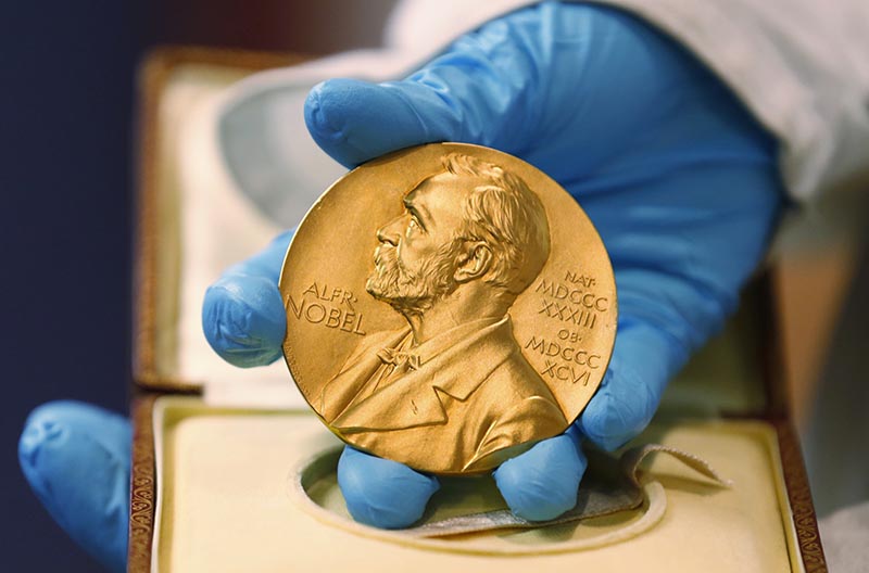 FILE- A national library employee shows the gold Nobel Prize medal awarded to the late novelist Gabriel Garcia Marquez, in Bogota, Colombia, on Friday, April 17, 2015. Photo: AP