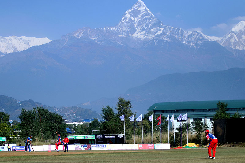 Players in action during the Namaste Pokhara Premier League T20 cricket tournament with Machhapuchhre Himal (Fishtail Mountain) as the backdrop, in Pokhara Metropolis, on Monday, October 29, 2018. Photo: RSS