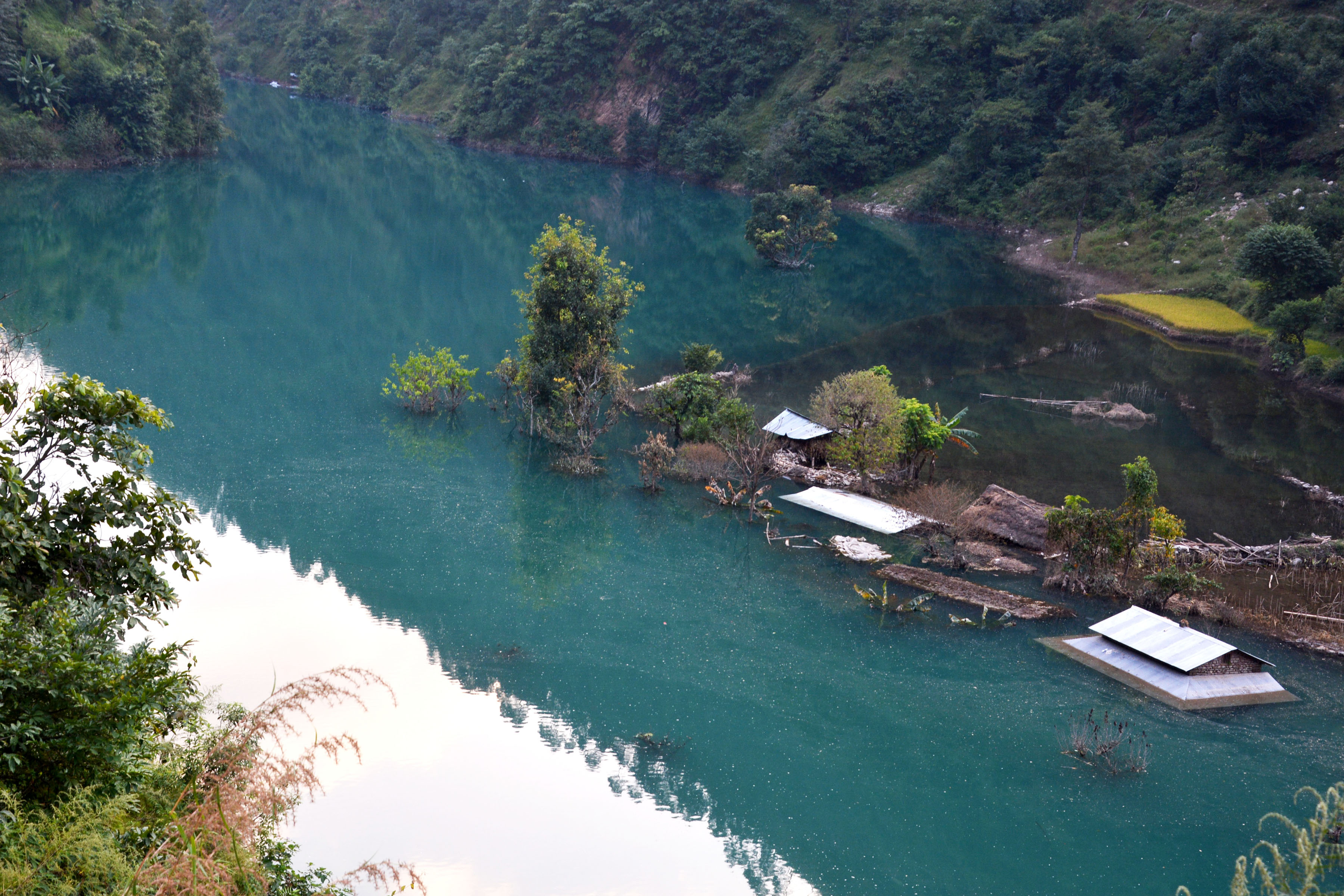 Water impounded by a landslide dam at Badigad River forms a lake partially  submerging houses in Turture in Baglung District. Photo: RSS