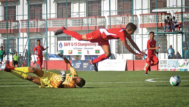 Players of Bangladesh and Nepal (right) in action during the SAFF U-15 Championship at the ANFA Complex grounds in Lalitpur on Monday. Photo: Naresh Shrestha/THT