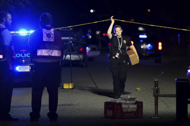 A member of the sheriff's department exits the crime scene on Ashton Drive in the Vintage Place neighborhood where several members of law enforcement were shot, one fatally, in Florence, South Carolin, on Wednesday, Oct. 3, 2018. Photo: AP