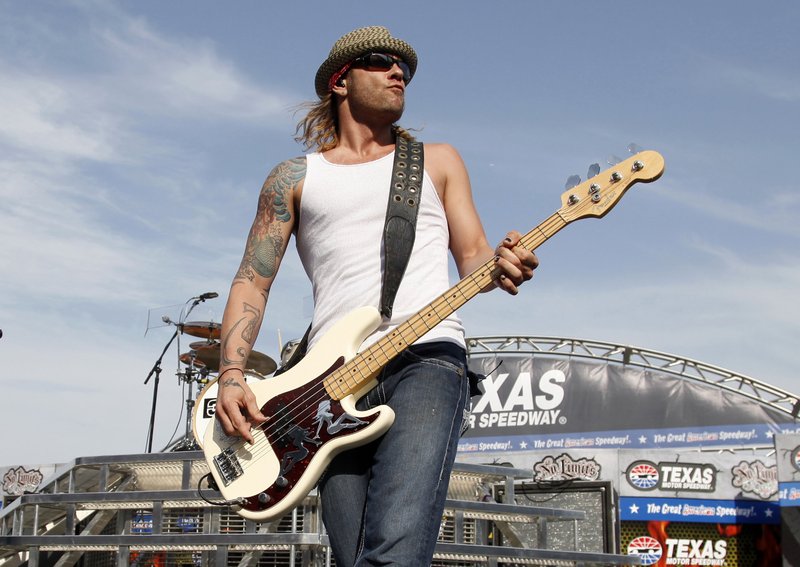 FILE - In this  photo, 3 Doors Down' bassist Todd Harrell performs before a NASCAR auto race at Texas Motor Speedway in Fort Worth, Texas on April 9, 2011. Photo: AP