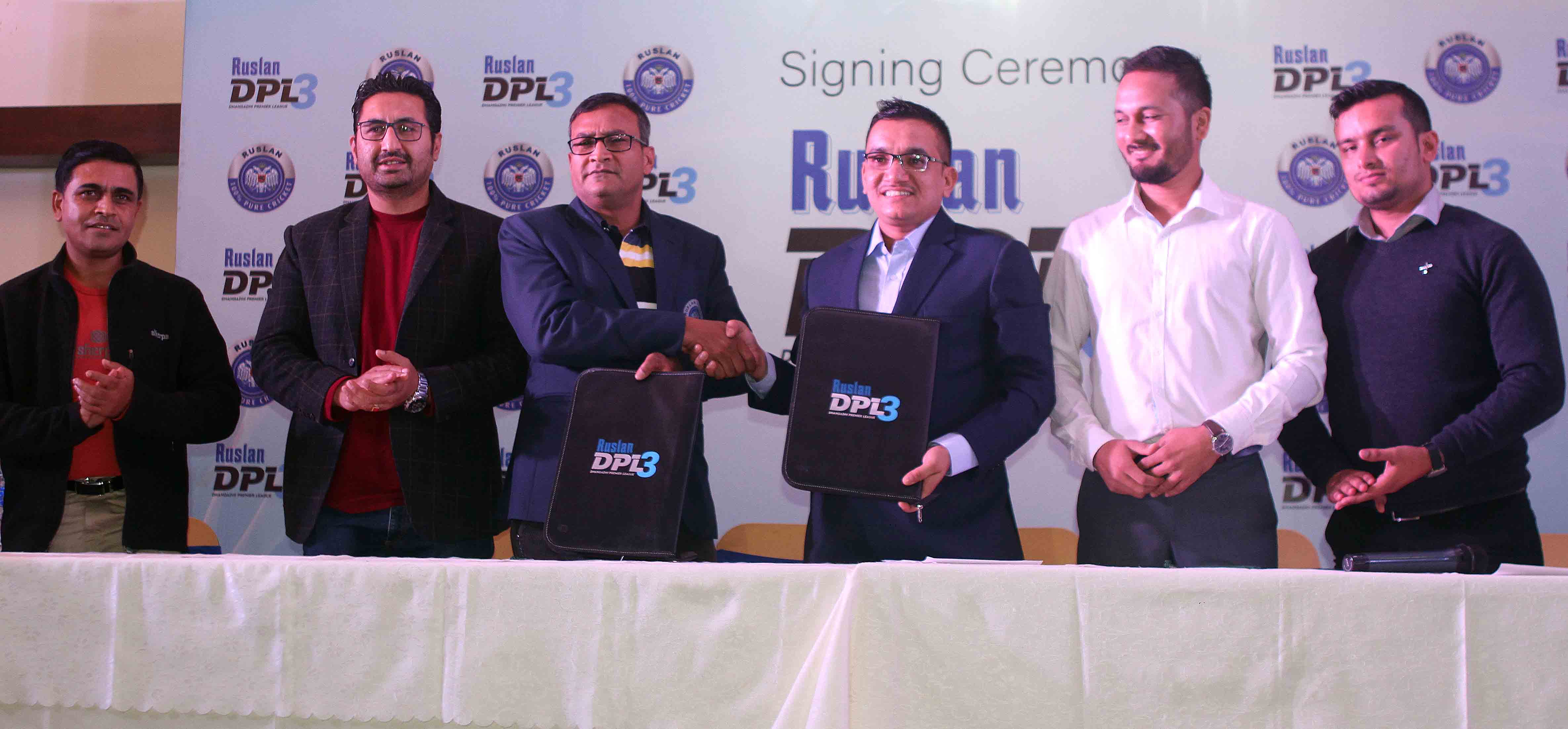 Subash Bahadur Shahi (third from right) President of Dhangadhi Cricket Academy exchanges MoU with Satish Karna (third from left) CFO of Bijay Distillery Pvt Limited during signing ceremony of Dhanagdhi Premier League 3 in Kathmandu on Friday, November 16, 2018. Photo: THT