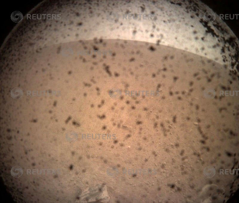NASA's InSight Mars lander acquired this image of the area in front of the lander using its lander-mounted, Instrument Context Camera (ICC) with the ICC image field of view of 124 x 124 degrees, on Mars, November 26, 2018.    NASA/JPL-Caltech/Handout via REUTERS     ATTENTION EDITORS - THIS IMAGE WAS PROVIDED BY A THIRD PARTY.?     TPX IMAGES OF THE DAY