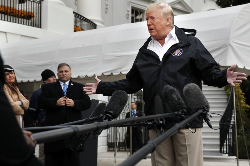 President Donald Trump answers questions from members of the media as he leaves the White House, Saturday Nov. 17, 2018, in Washington, en route to see fire damage in California.  Photo: AP