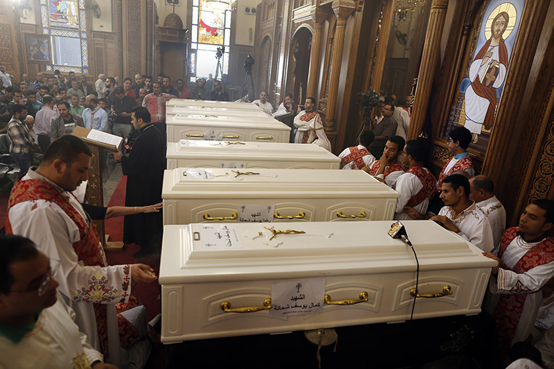 Coffins of the slain Coptic Christians are seen during their funeral service at Church of Great Martyr Prince Tadros, in Minya, Egypt, on Saturday, November 3, 2018.Coptic Christians in the Egyptian town of Minya prepared to bury their dead, a day after militants ambushed three buses carrying Christian pilgrims on their way to a remote desert monastery, killing seven and wounding 19. Photo: AP