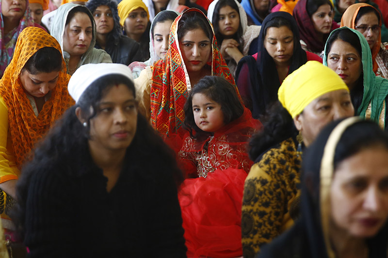 Women from the Sikh community gather for prayers during Guru Nanak Jayanti, a Sikh festival that marks the 549th birth anniversary of Guru Nanak, at a Gurudwara, in Lalitpur, on Friday, November 23, 2018. Photo: Skanda Gautam/THT
