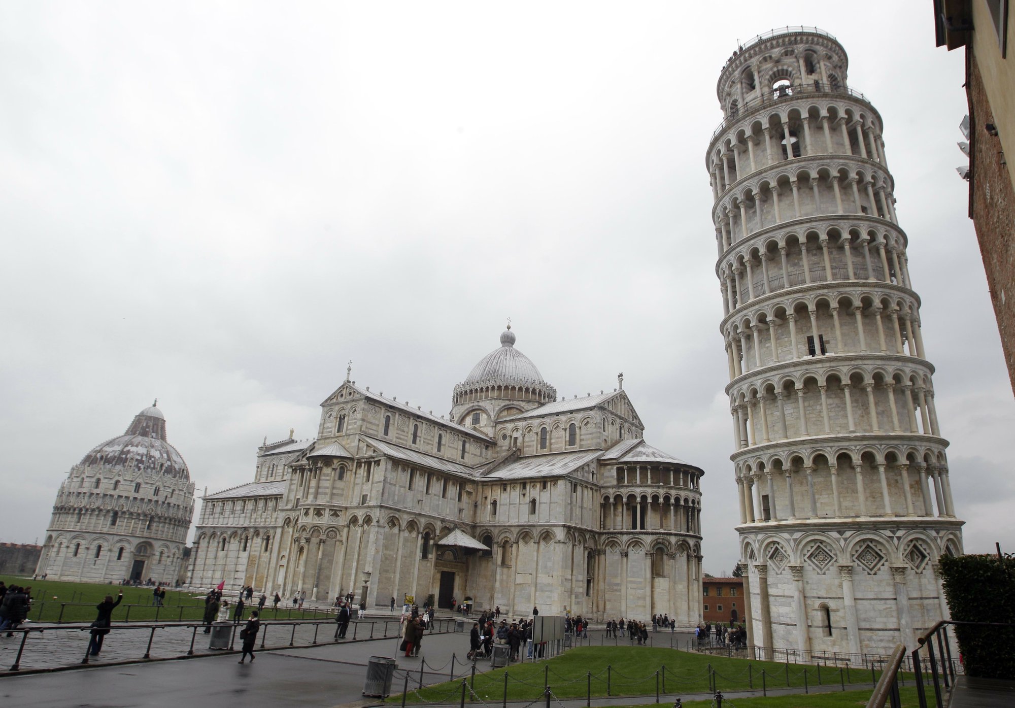 The Leaning Tower of Pisa (Torre di Pisa) is seen at right next to the medieval cathedral of Pisa, in Piazza dei Miracoli Square, in Pisa, Italy, on Sunday, Jan. 2, 2012. Photo: AP