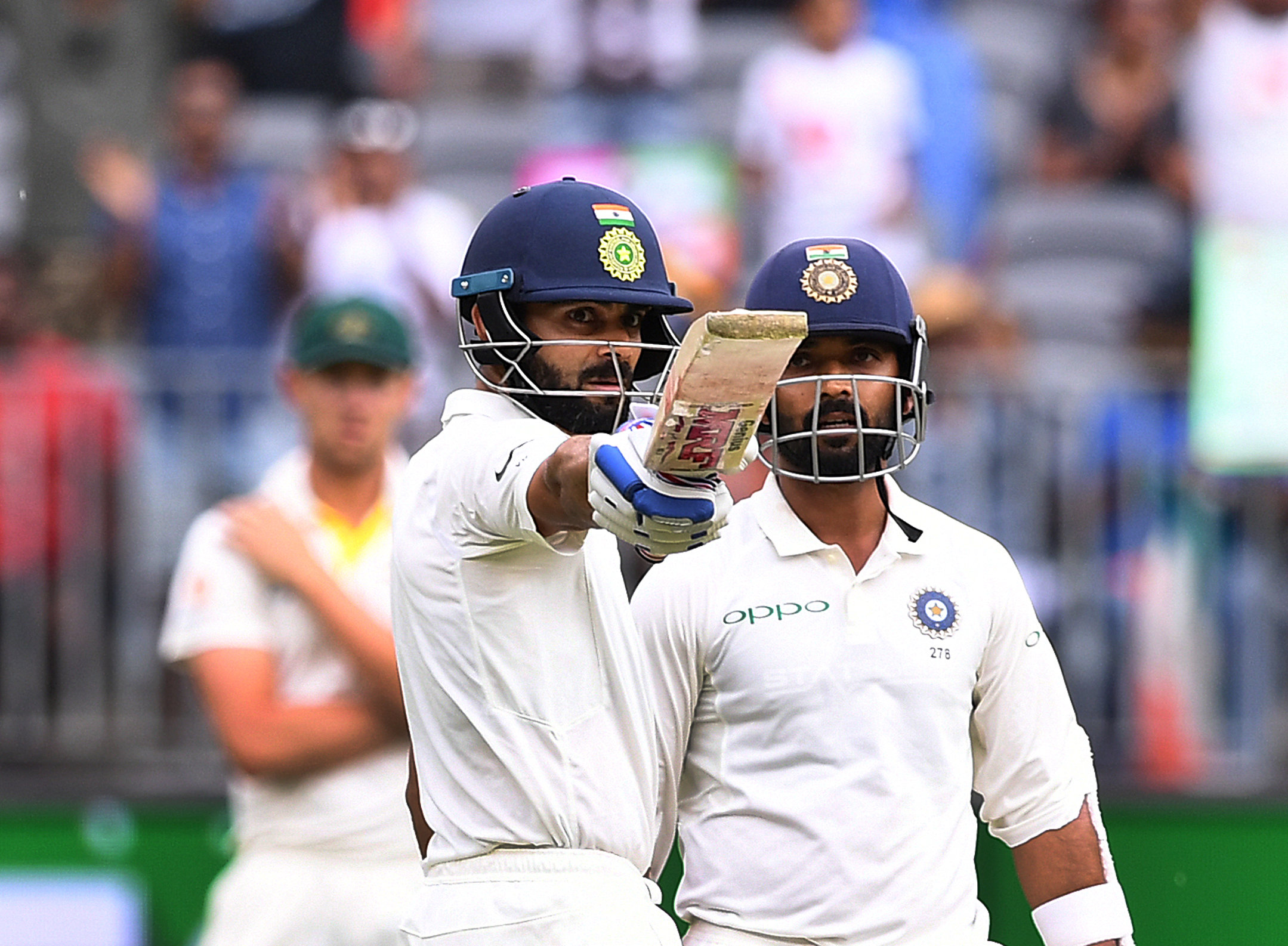 India's captain Virat Kohli raises his bat after scoring his half century on day two of the second test match between Australia and India at Perth Stadium in Perth, Australia, December 15, 2018. Reuters