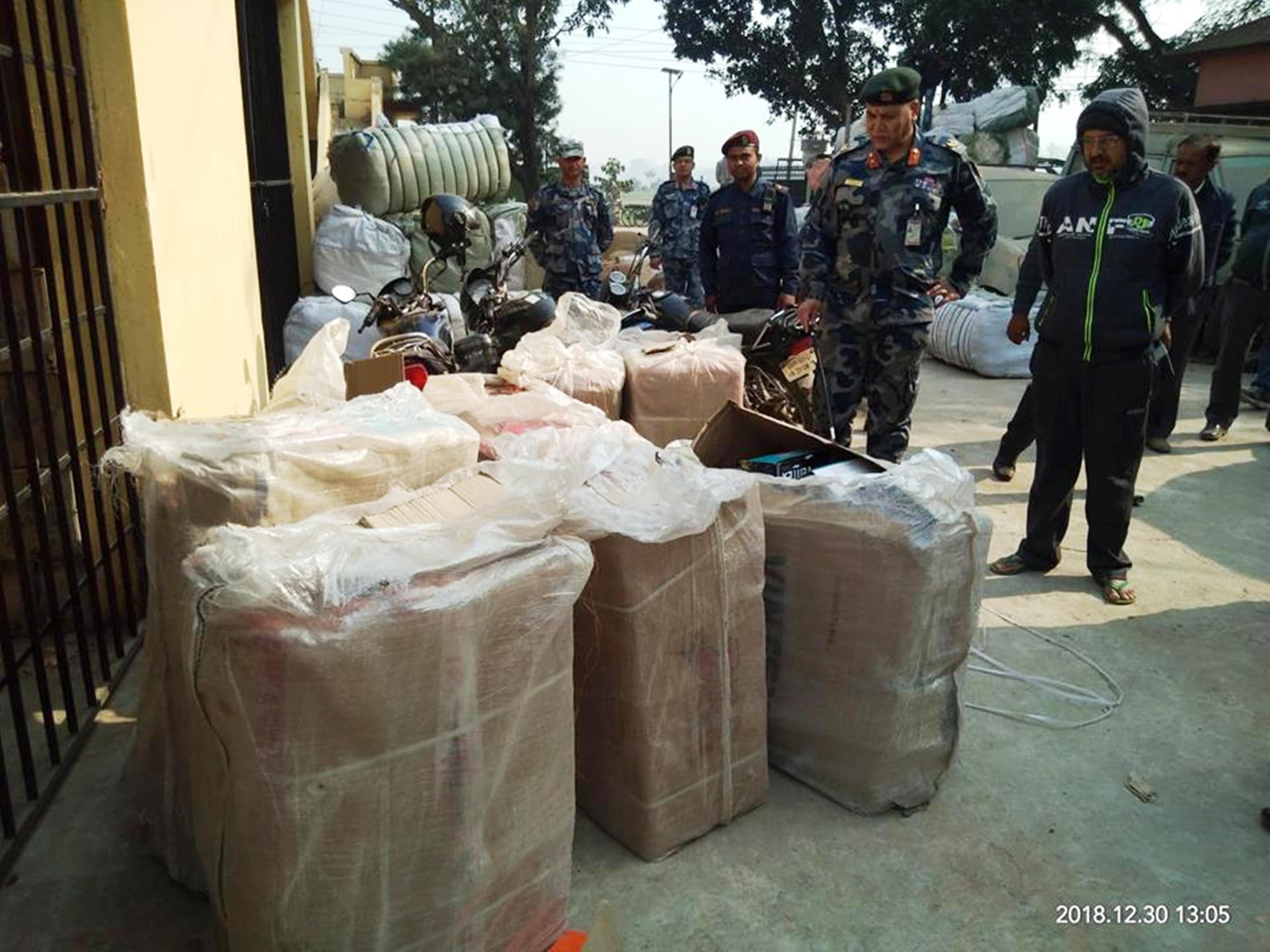 APF personnel hand over seized goods to Gaur Customs Office on December 30, 2018. Photo: Prabhat Kumar Jha/THT