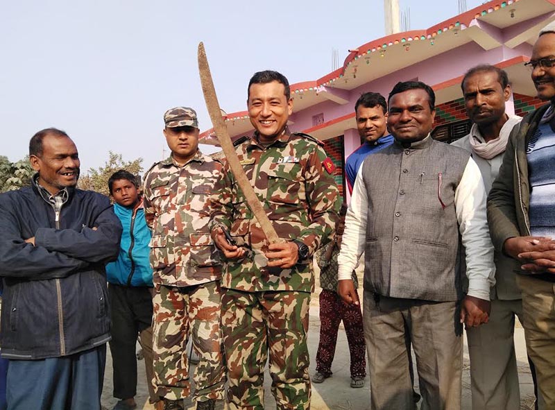 A Nepali Army officer holding a sword believed to have been used in the Anglo-Nepal war, in Gadhimai Municipality, on Saturday, December 29, 2018. Photo: THT
