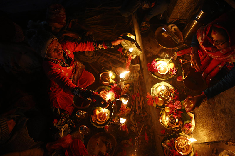 Nepali women light oil lamps in remembrance of their departed family members during Bala Chaturdashi festival, at Pashupatinath Temple, in Kathmandu, on Wednesday, December 05, 2018. Photo: Skanda Gautam/THT