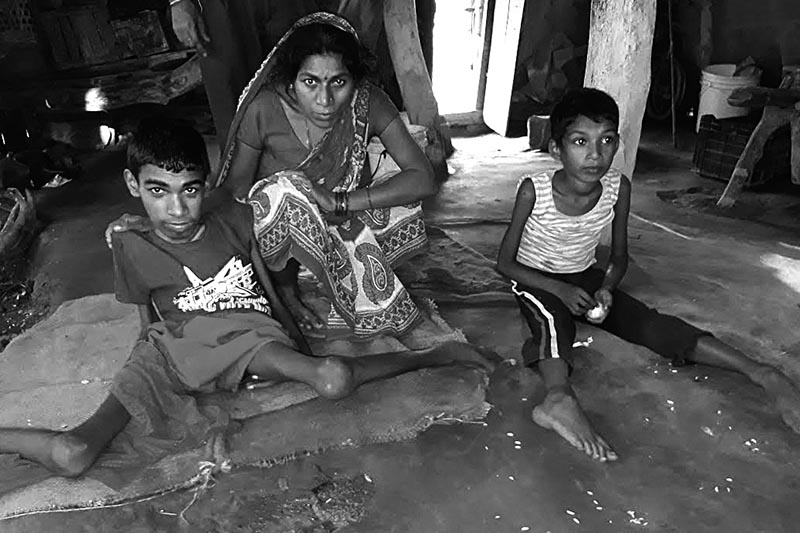 A woman with her physically challenged children, in Jaitpur, Bara, on Saturday. Photo: THT