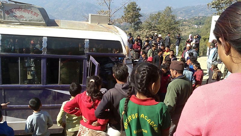 People gather to look at the passenger bus of 'Sumnima Paruhang Yatayat' near Deurali Chok, in Bhojpur Municipality-6, in Bhojpur district , on Saturday, December 29, 2018. Photo: Niroj Koirala/THT