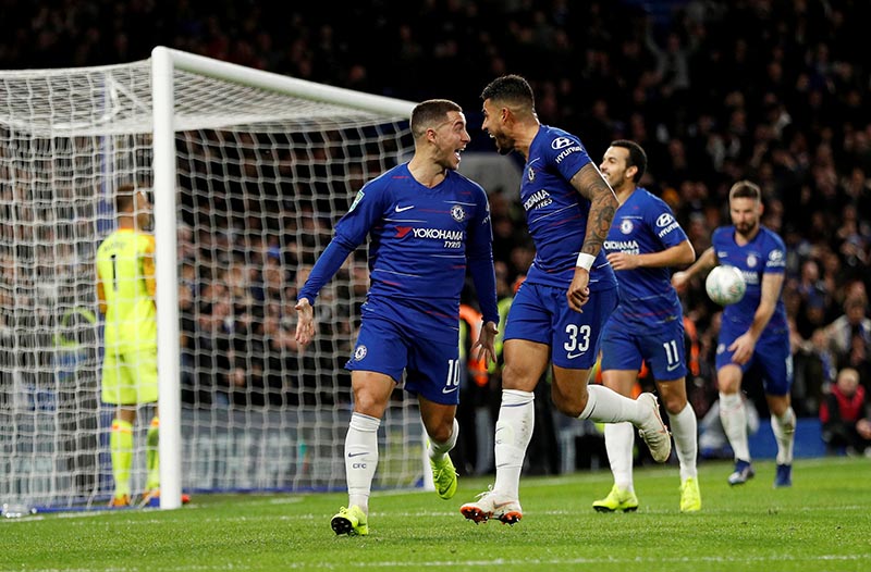 Chelsea's Eden Hazard celebrates scoring their first goal with Emerson Palmieri during the Carabao Cup Quarter-Final metch between Chelsea and AFC Bournemouth, at Stamford Bridge, in London, Britain, on December 19, 2018. Photo: Reuters