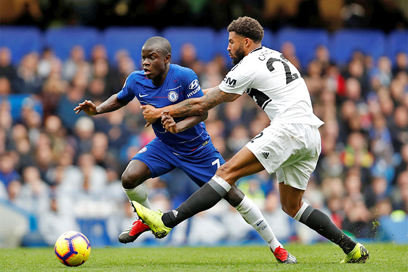 Chelsea's N'Golo Kante in action with Fulham's Cyrus Christie. Photo: Reuters