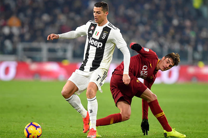 Juventus' Cristiano Ronaldo in action with AS Roma's Patrik Schick. Photo: Reuters   REUTERS/Massimo Pinca