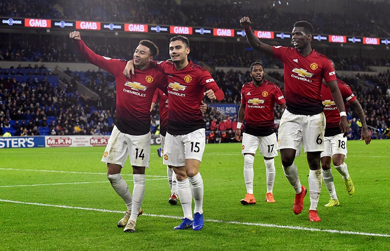 Manchester United's Jesse Lingard celebrates scoring their fifth goal with team mates during the Premier League match between Cardiff City and Manchester United, at Cardiff City Stadium,in  Cardiff, Britain, on December 22, 2018. Photo: Reuters