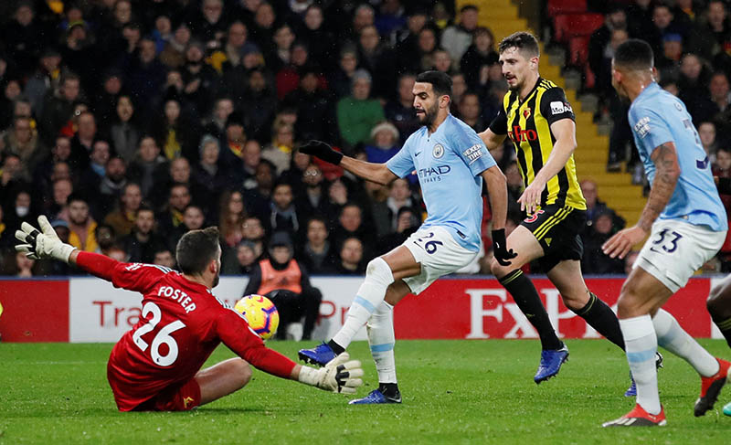 Watford's Ben Foster in action with Manchester City's Riyad Mahrez during the Premier League match between Watford and Manchester City, at Vicarage Road, in Watford,  Britain, on December 4, 2018. Photo: Reuters