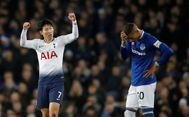Tottenham's Son Heung-min celebrates scoring their first goal as Everton's Richarlison looks dejected during the Premier League match between Everton and Tottenham Hotspur, at Goodison Park, in Liverpool, Britain, on December 23, 2018. Photo: Action Images via Reuters