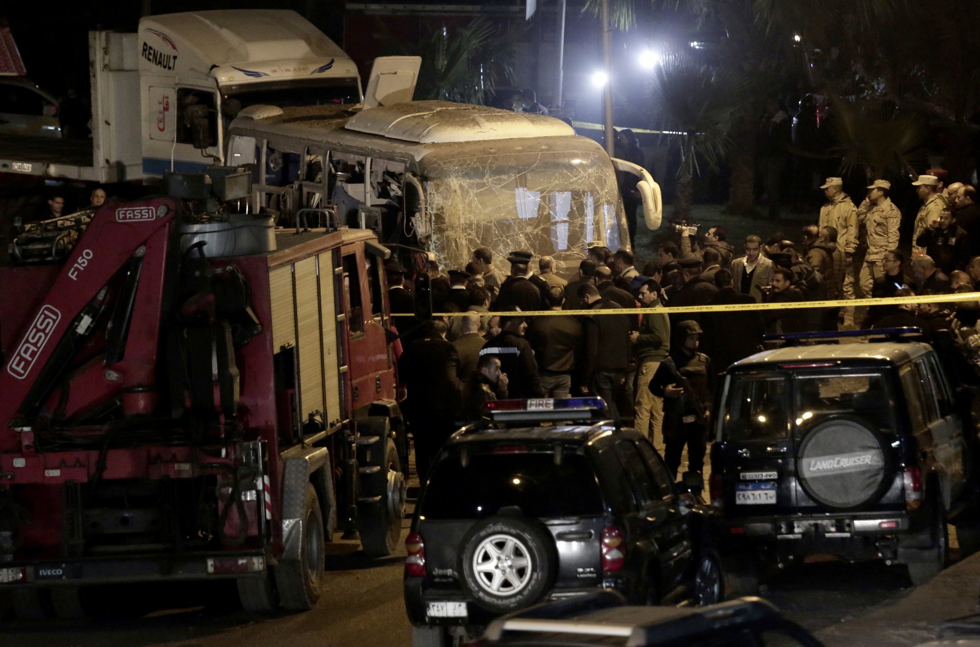 Security forces stand near a tourist bus after a roadside bomb in an area near the Giza Pyramids in Cairo, Egypt. Photo: AP