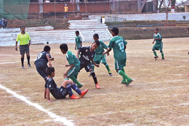 Players of Moran Memorial School and Bright Future in action during the Fr Moran Memorial Football Tournament on Sunday.