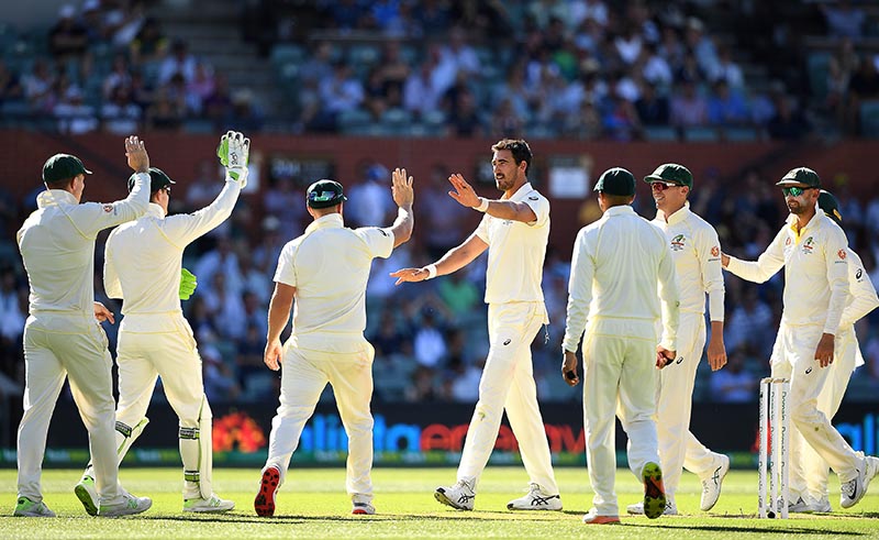 Australia's Mitchell Starc (C) celebrates after taking a wicket during day one of the first test match between Australia and India at the Adelaide Oval in Adelaide, Australia, December 6, 2018. Photo: AAP/Dave Hunt/via Reuters