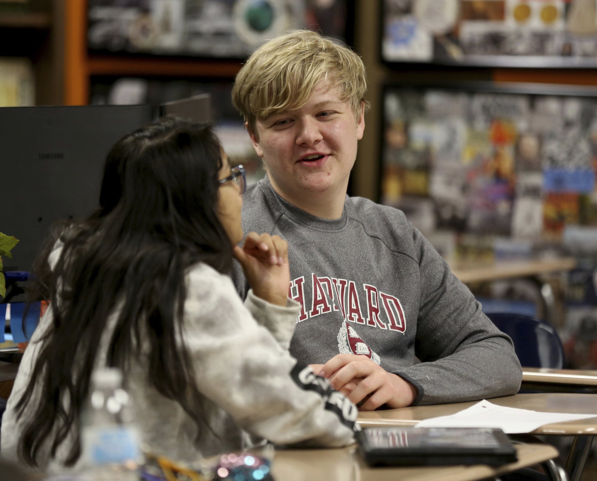 Government class students Alejandra Corral, left, and Braxton Moral work on calculating the estimated cost of living expenses as part of a talk about students who graduate high school making on average more money than non-graduates, at Ulysses High School in Ulysses, Kan., on Wednesday, Dec. 12, 2018. Photo: AP