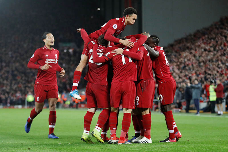 Liverpool's Roberto Firmino (hidden) celebrates scoring their second goal with team mates. Photo: Reuters