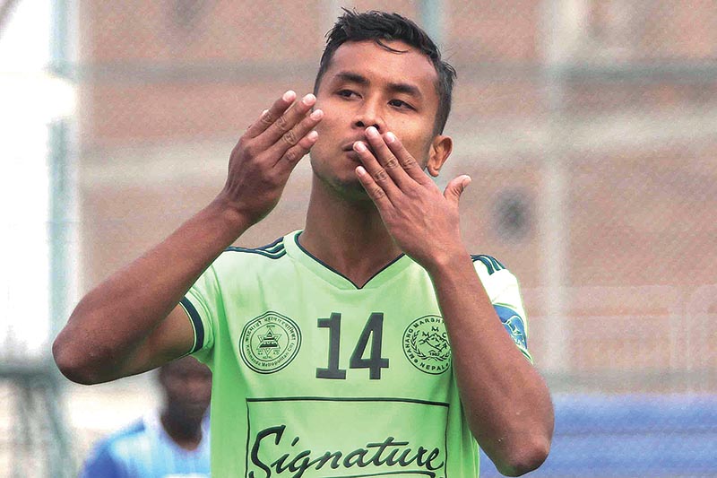 Anjan Bista of Signature MMC celebrates after scoring a goal against Grandmaster JYC during their Pulsar Martyrs Memorial A Division League match in Lalitpur on Wednesday. Photo: THT