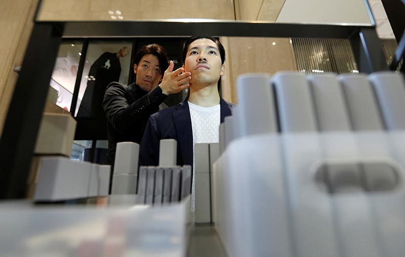 Model Masafumi is made up by make-up artist Hiroki using Pola Orbis subsidiary Acro's cosmetics during their demonstration at a department store in Tokyo, Japan, on September 28, 2018. Photo: Reuters