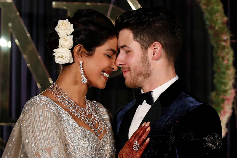 Bollywood actress Priyanka Chopra and her husband singer Nick Jonas pose during a photo opportunity at their wedding reception in New Delhi, India December 4, 2018. Photo: Reuters