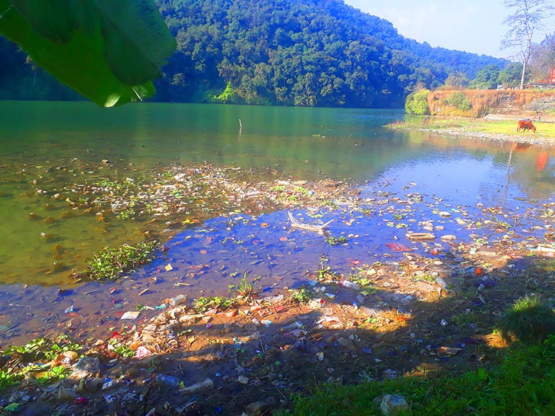 A view of waste floating in Phewa lake in Pokhara, Kaski district, on Tuesday, December 11, 2018. The wastes from Phikenkhola directly flow into the lake. The Ministry of Culture, Tourism and Civil Aviation has prepared to invite 2 million tourists for the visit Nepal campaign 2020. Photo: Rishi Ram Baral/THT