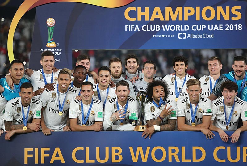 Real Madrid players celebrate with the trophy after winning the Club World Cup during the Club World Cup and Final match between Real Madrid and Al Ain, at Zayed Sports City Stadium, in Abu Dhabi, United Arab Emirates, on December 22, 2018. Photo: Reuters