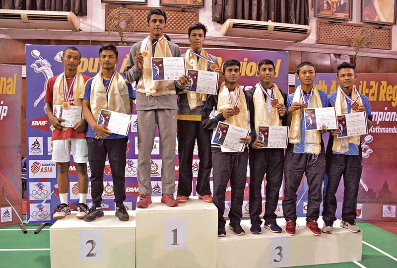 Winners of the menu2019s doubles hold their medals on the podium after the second South Asian U-21 Regional Badminton Championship in Kathmandu on Sunday. Photo: THT